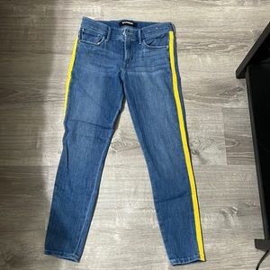 Express legging mid rise jean with yellow stripe down side. Like new!